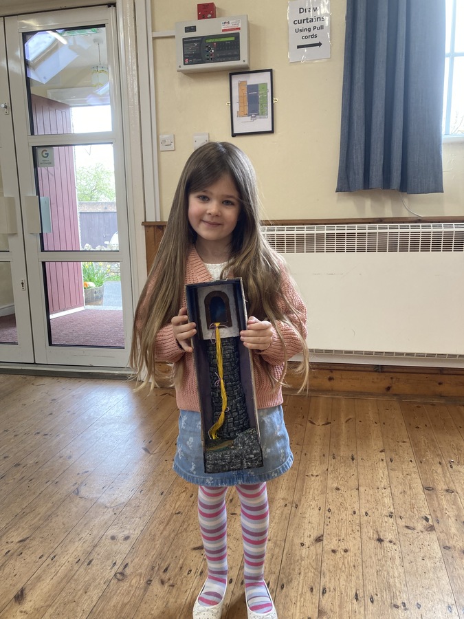 Ella holding her Rapunzel tower